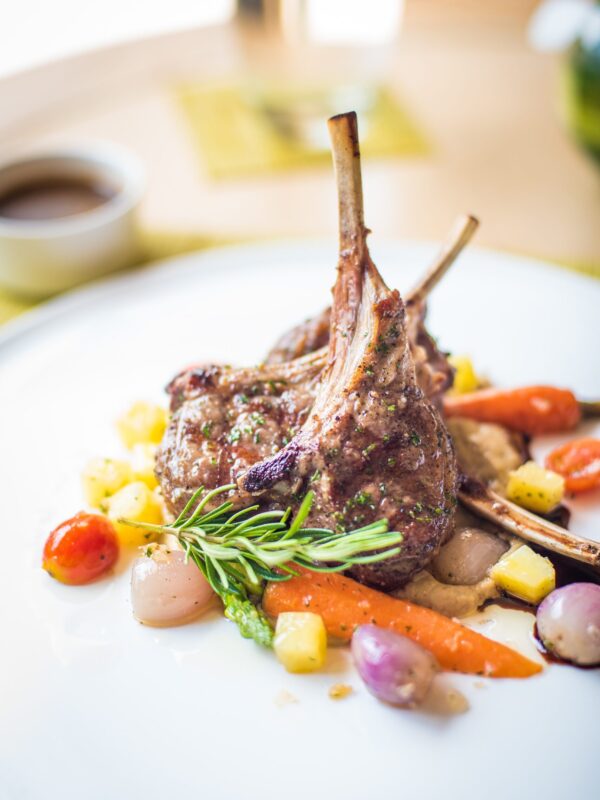 A Culinary Symphony: Herb-Crusted Lamb Chops with Roasted Vegetables